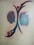 Tattoo with fingerprints from my mother and father. Made by 
