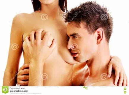 Man kissing woman breast