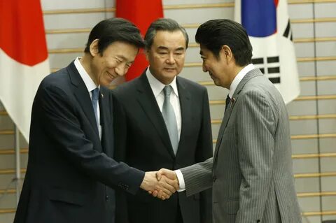 Japanese Prime Minister Shinzo Abe (right) meets South Korean Foreign Minis...