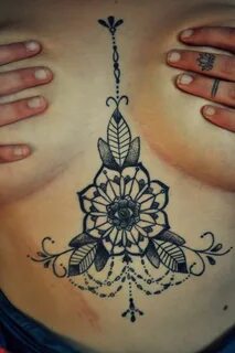 Under boob lotus tattoo
