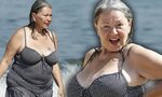 Roseanne Barr, 58, emerges from the sea in a polka dot swims