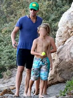 Chris Martin hits the beach for father-son time with Moses