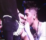 One Direction's Zayn Malik nibbles at Harry Styles' candy th