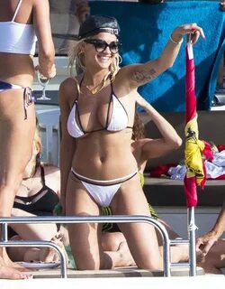 Rita Ora Hits the Beach in Ibiza in White Sexy Bikini after 