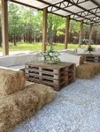 Hay bales and pallets for seating Outdoor wedding decoration