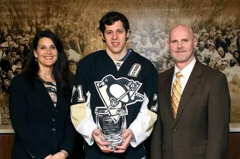 Evgeni Malkin is presented with the EJD Memorial Community S