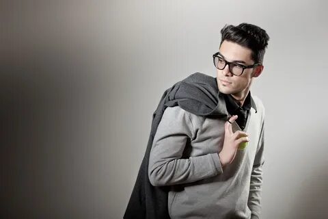 attractive man dressed casual wearing glasses - studio shot,