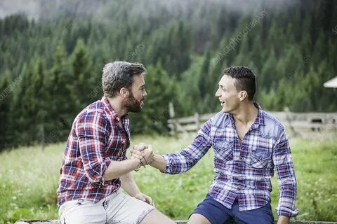 Two male friends shaking hands - Stock Image - F009/8310 - S