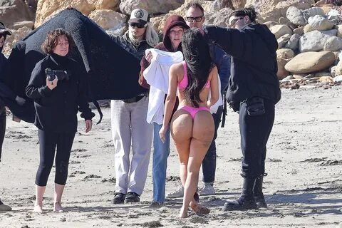 Kim Kardashian shows off her bare butt in a pink thong bikini in rare pics ...
