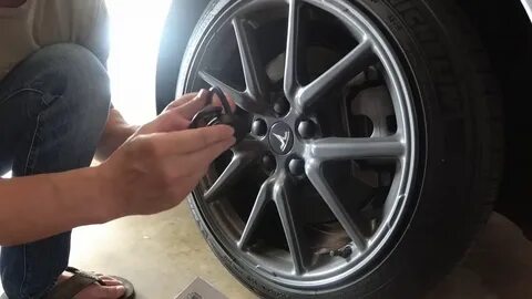 Remove Tesla Center cap using suction cup - YouTube