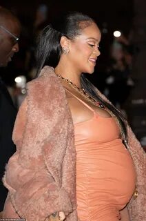 Pregnant Rihanna highlights her baby bump in a leather mini 
