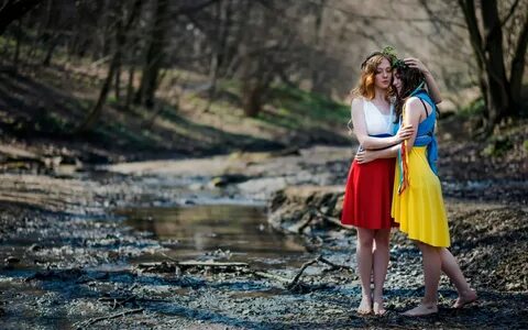 Wallpaper Two girls in bright dresses in the woods " On-desk