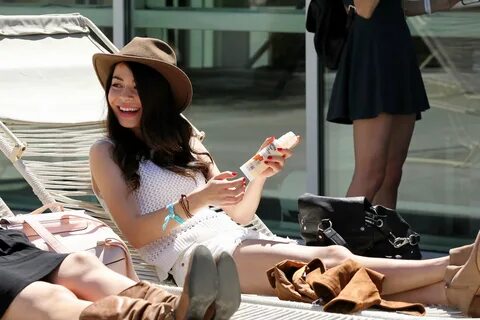 Miranda Cosgrove is all smiles as she applies Hawaiian Tropic Silk Hydratio...