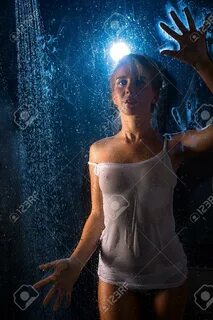 Woman In Wet T-shirt In Shower View In The Dark Stock Photo,