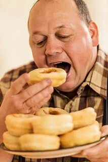 Best Fat Guy Eating Donuts Stock Photos, Pictures & Royalty-