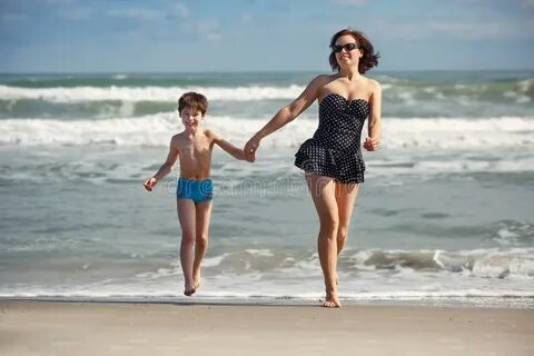 Young Mother and Son Playing on the Beach Stock Photo - Imag