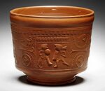 A Roman red gloss ware bowl with gladiator decoration Circa 