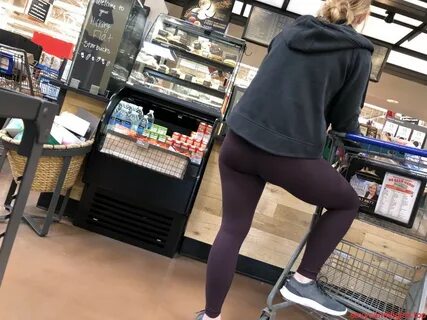 Girl in Tights With One Leg Standing on a Shopping Cart Cree