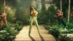 All neon green Saks Pott of Selena Gomez in the video for DJ
