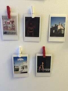 Sale hanging polaroids on wall in stock