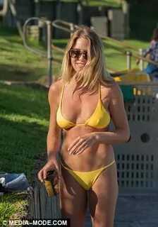 Lisa Clark dons a yellow bikini as she meets Tim Dormer Dail