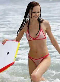 skinny girl in seethrough bikini rides boogie board - Voyeur