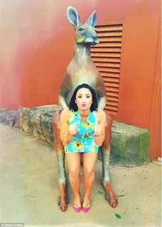 Demi Lovato puckers up for a kiss with a cute quokka at an A