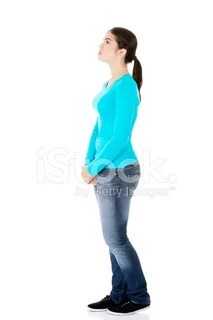 Attractive Woman Standing Looking On Copy Space. Stock Photo