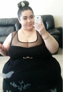 Shirt from Torrid paired with leggings and necklace from Dom