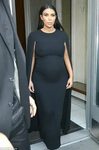 A somber pregnant Kim Kardashian dons black caped gown in NY