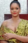 RIHANNA's Boobs almost popped out in CLEAVAGE revealing dres