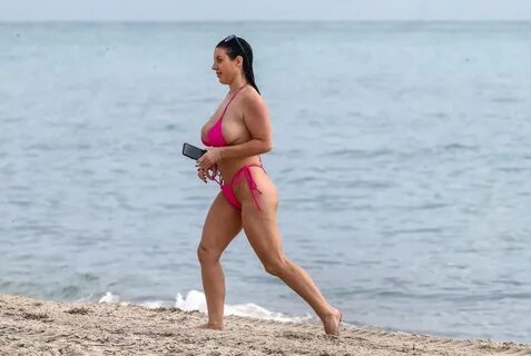Angela White showcase her ample assets in a Pink bikini in M