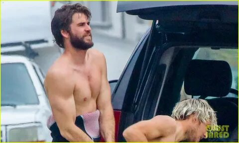 Full Sized Photo of liam hemsworth strips shirtless surfing 