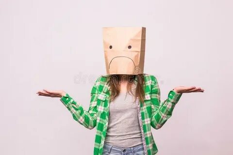 Unhappy Woman with Sad Emoticon in Front of Paper Bag on Her