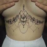 Татуировки на женской груди - 62 фото
