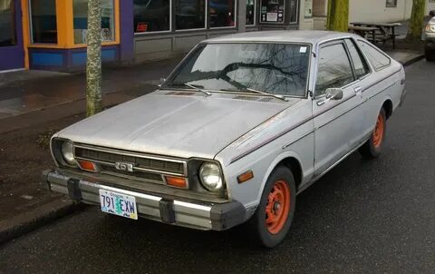 OLD PARKED CARS.: 1979 Datsun 210 Hatchback.