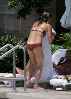 Ashley Greene shows off her hot body in a skimpy rust colore