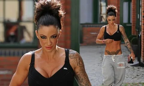 Jodie Marsh shows off her copious body art in full face of m