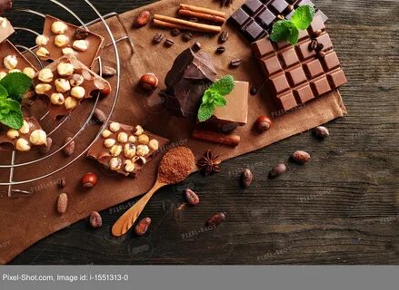 Chocolate with nuts and mint on metal stand, closeup :: Stoc