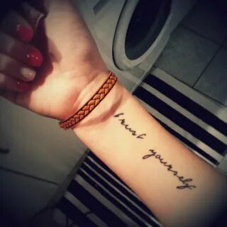 "Trust yourself" tattoo on Jasmin's forearm.