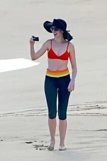 Anne Hathaway showing pokies in wet bikini tops on a Hawaiia
