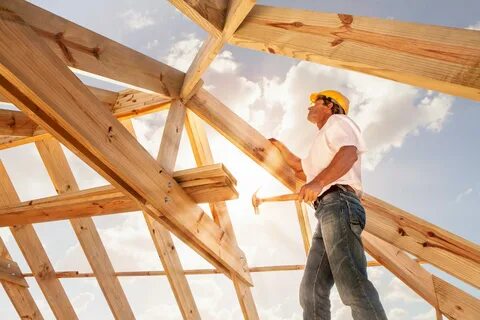 Worker,Roofer,Builder,Working,On,Roof,Structure,On,Construct