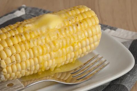Cooked corn cob with butter - Free Stock Image