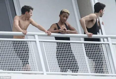 Jaden Smith shows off his arm strength as he plays around li