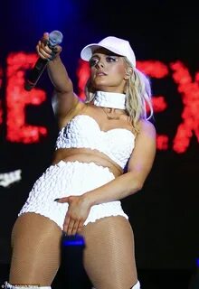 Bebe Rexha sizzles in a risque cleavage-baring bodysuit and 