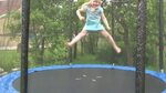 beautiful little girl jumping on trampoline: стоковое видео 
