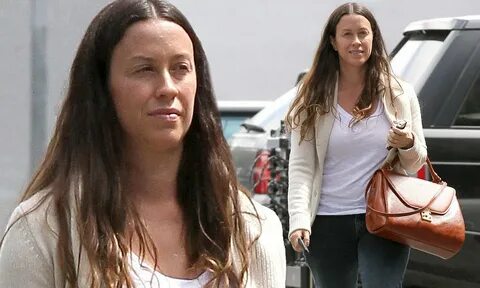 Alanis Morissette goes out make-up free yet still displays a