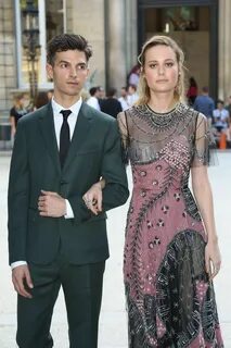 Brie Larson braless in transparent lace gown arriving at Val