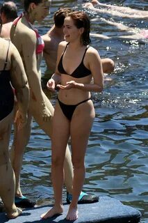 Zoey Deutch seen wearing a black bikini as she goes for a sw
