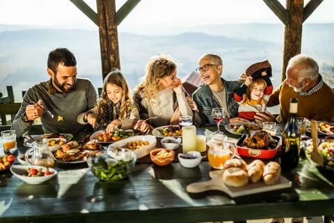 Why do people eat more when dining with friends and family?